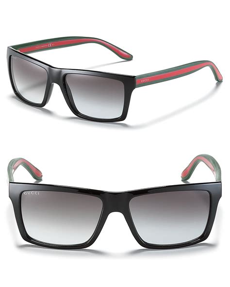 Gucci: Black Wayfarer Sunglasses .